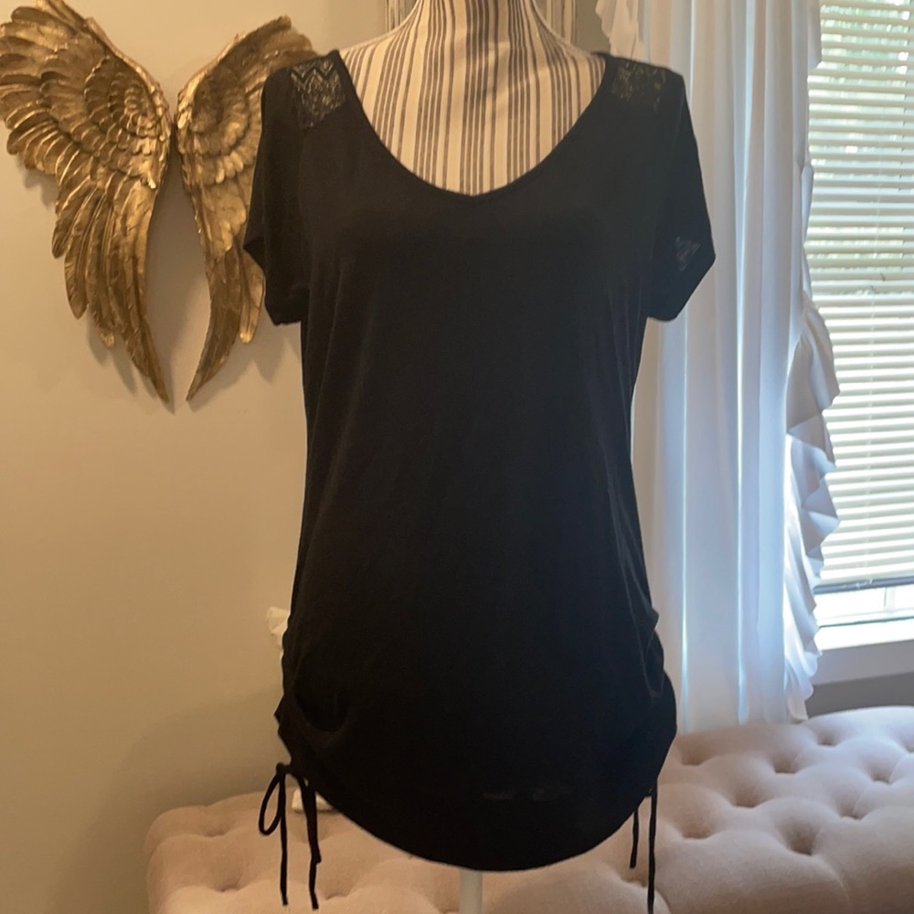 Cute shirt with  cross back and ties on sides